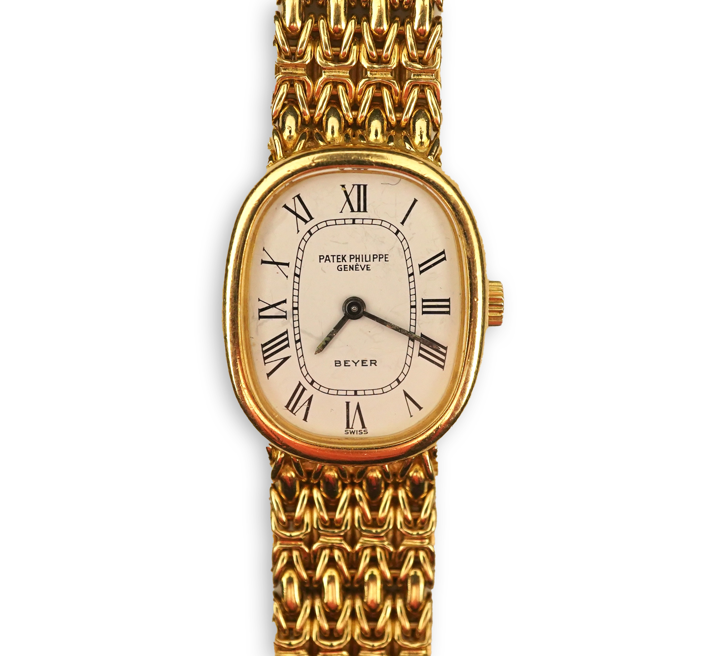 A lady's 18ct gold Patek Philippe manual wind wrist watch, on an integral 18ct gold Patek Philippe bracelet